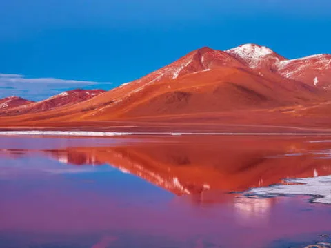The deep red water of Laguna Colorada The deep red water of Laguna Colorada