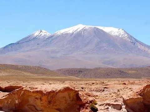 The snow-capped Ollagüe volcano The snow-capped Ollagüe volcano